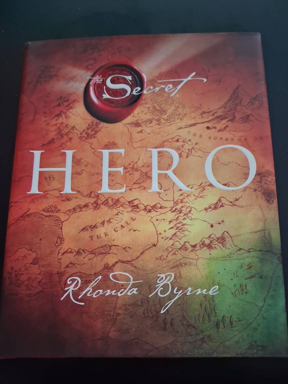 The Secret: HERO Decorative Coffee Table Book by - Red, Orange, Green